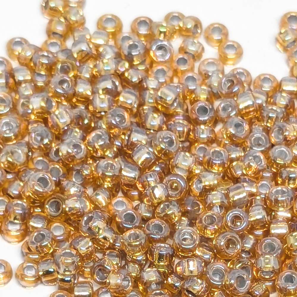 15/0 MIYUKI Rocalla 1004 - Silver Lined Dark Gold AB - 1 gr.