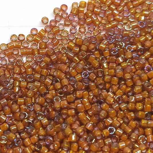 11/0 MIYUKI delica DB1779 White Lined Dark Topaz AB - 1gr.  - Miyukilandia