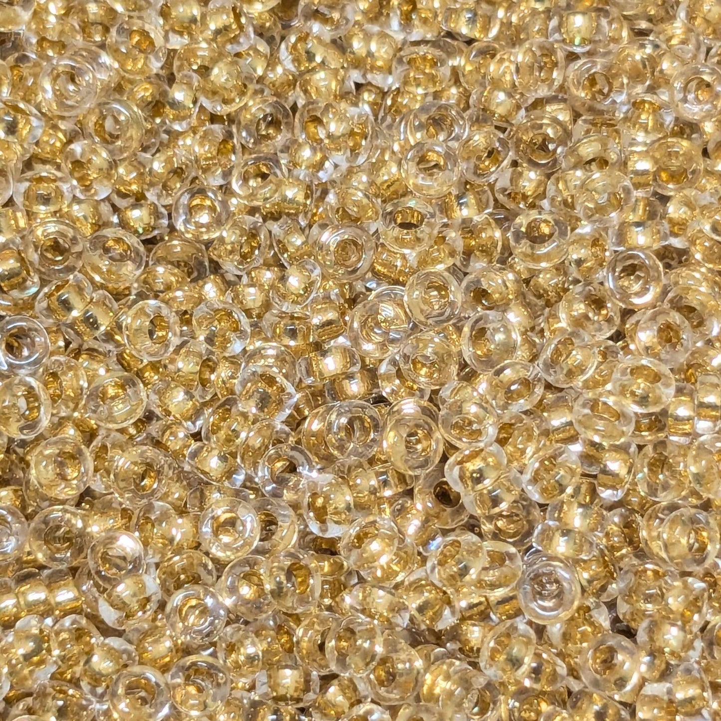 Distanciadores Miyuki 2,2 mm x 1,3 mm 24Kt Gold Lined Crystal - Col. 195